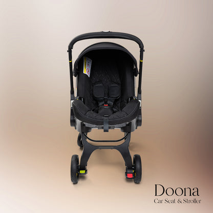 Ultimate All-in-One Doona Car Seat & Stroller in Nitro Black with convertible car seat and stroller, featuring ergonomic support, premium safety features, and an adjustable handlebar for convenient and safe travel with your infant.