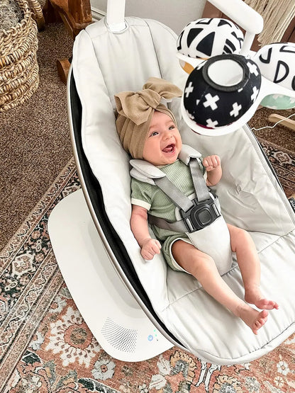 BABY IN Grey MamaRoo Multi-Motion Baby Swing featuring a machine-washable seat cover, removable toy bar, and app compatibility for customizable motions and sounds.