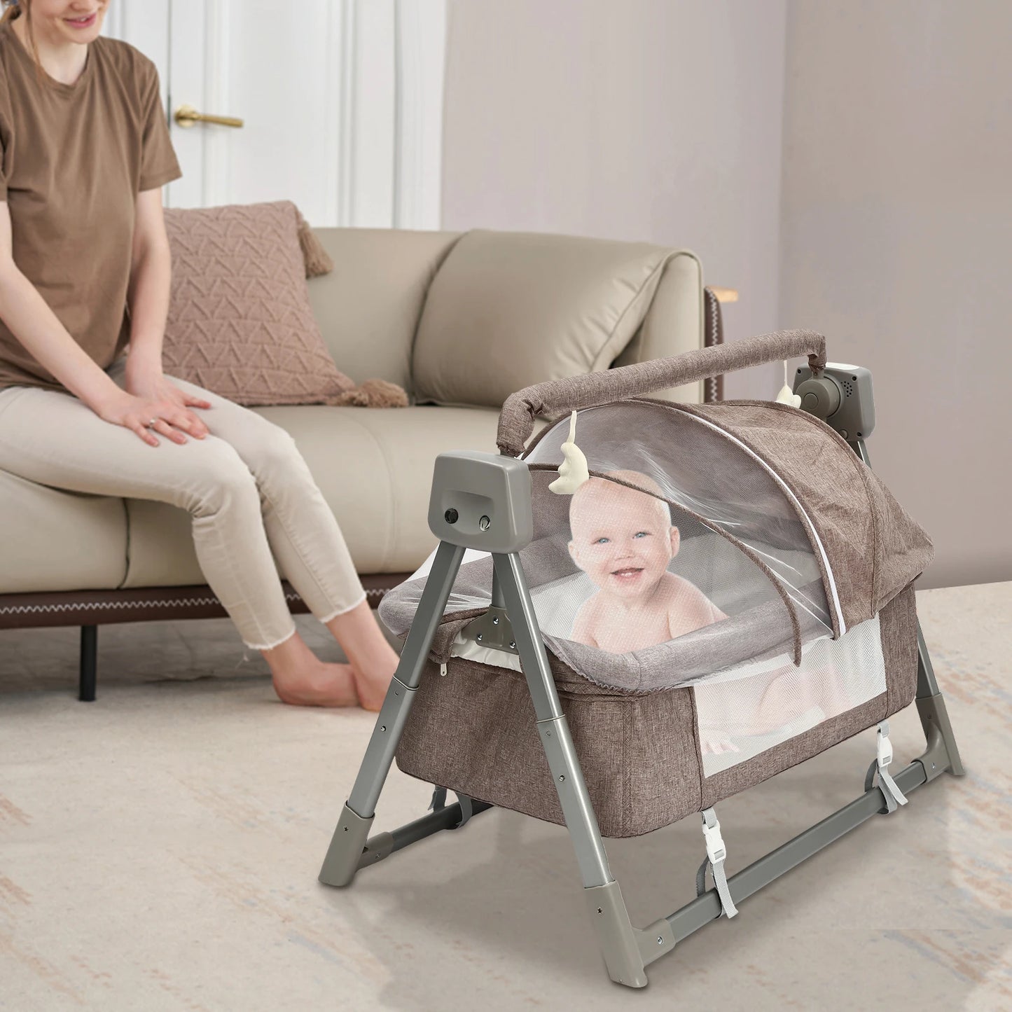 Mother watching her son playing in Little Ones® BassiNest Flex Portable Bassinet