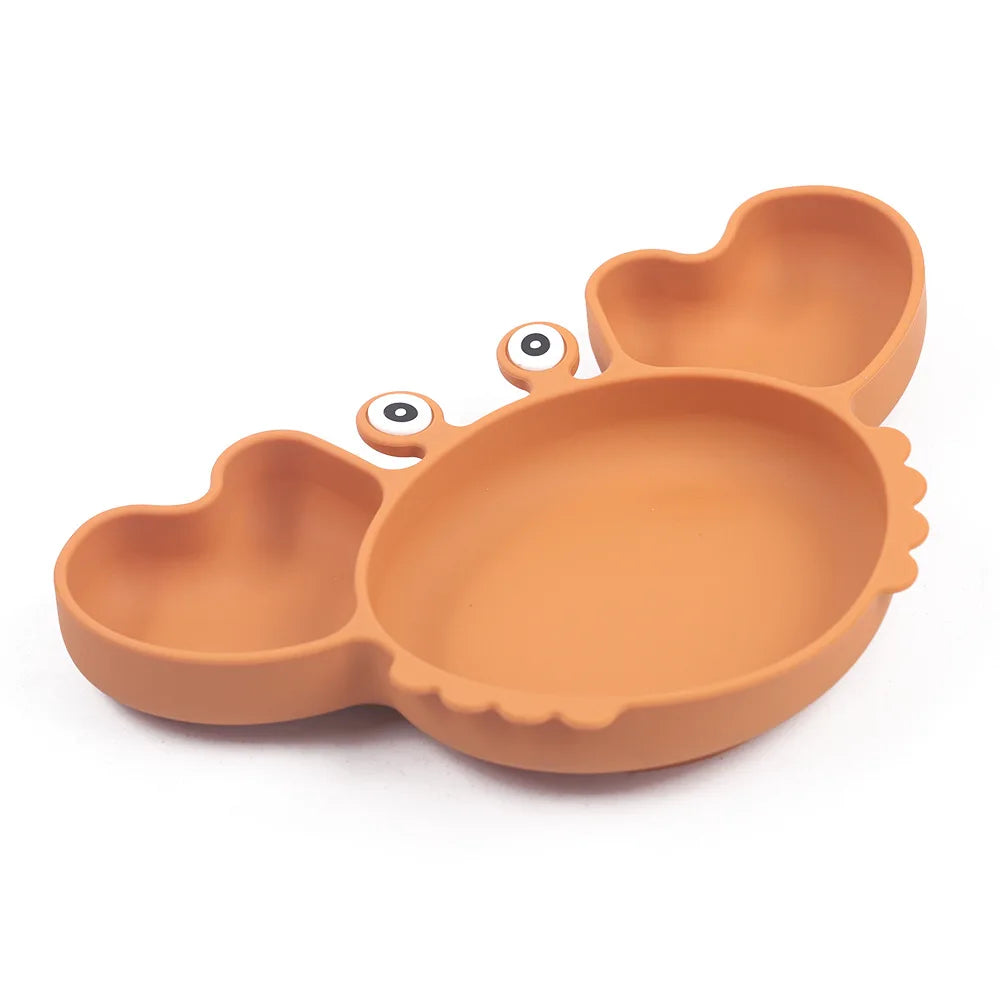 orange variant of 9-piece best silicone baby feeding set including a non-slip suction bowl, plate, spoon, waterproof bib, cup, and crab-shaped dishes. BPA-free and designed for children aged 7-36 months, this dinnerware set ensures safe and mess-free mealtime.