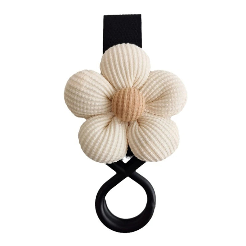 BloomLoop™ Baby Stroller Hook in White-Black - Versatile stroller accessory with a small flower pattern for extra storage.