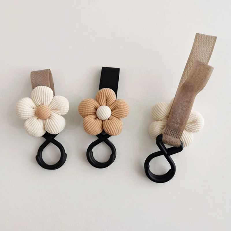 WHITE, BROWN AND PINK COLOR BloomLoop™ Baby Stroller Hook - Versatile stroller accessory with a small flower pattern for extra storage.