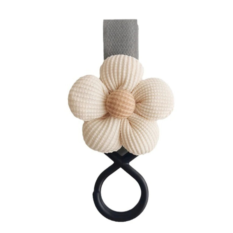 BloomLoop™ Baby Stroller Hook in Beige - Versatile stroller accessory with a small flower pattern for extra storage.