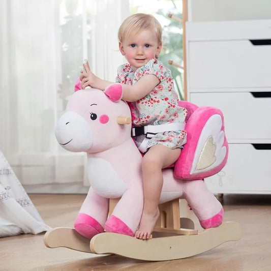 A baby girl riding on Pink Unicorn Plush Animal Rocker for kids - a soft, safe, and premium ride-on toy designed to improve balance and motor skills.