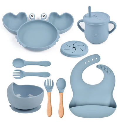 blue variant of 9-piece best silicone baby feeding set including a non-slip suction bowl, plate, spoon, waterproof bib, cup, and crab-shaped dishes. BPA-free and designed for children aged 7-36 months, this dinnerware set ensures safe and mess-free mealtime.