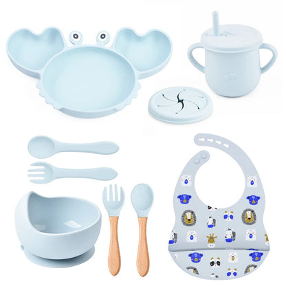 light blue variant of 9-piece best silicone baby feeding set including a non-slip suction bowl, plate, spoon, waterproof bib, cup, and crab-shaped dishes. BPA-free and designed for children aged 7-36 months, this dinnerware set ensures safe and mess-free mealtime.