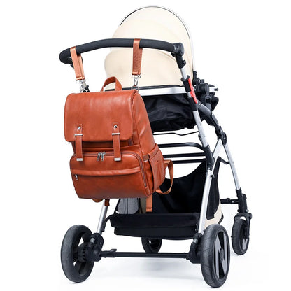 LuxeCarry™ Leather Diaper Bag in Brown in baby stroller - Elegant and durable diaper bag for travel and daily use.