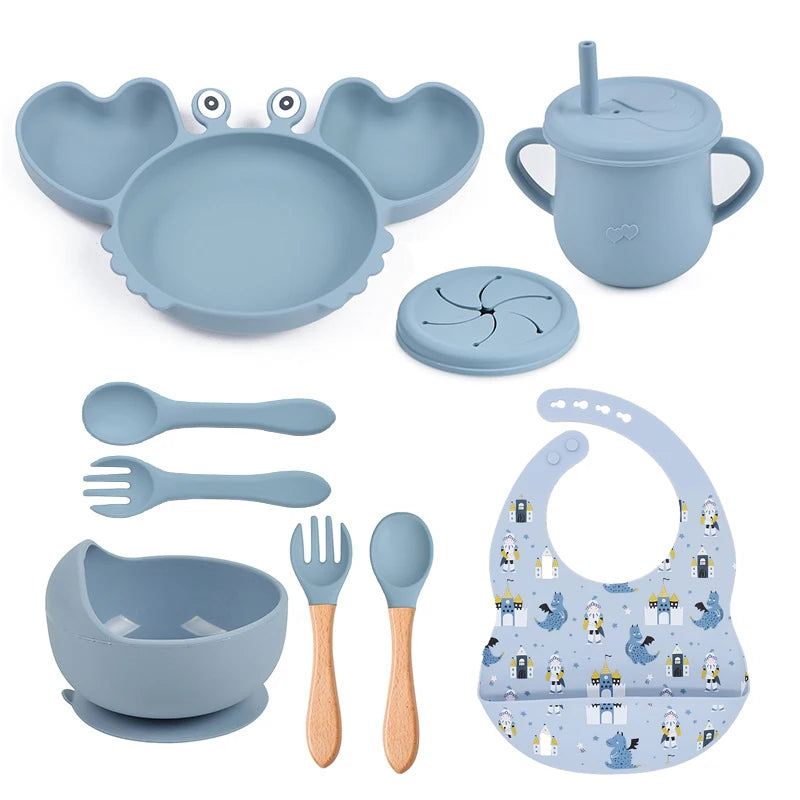 dark blue variant of 9-piece best silicone baby feeding set including a non-slip suction bowl, plate, spoon, waterproof bib, cup, and crab-shaped dishes. BPA-free and designed for children aged 7-36 months, this dinnerware set ensures safe and mess-free mealtime.