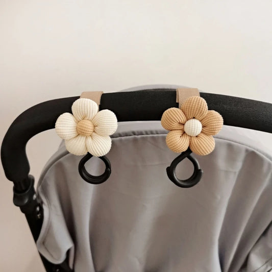 BloomLoop™ Baby Stroller Hook - Versatile stroller accessory with a small flower pattern for extra storage.