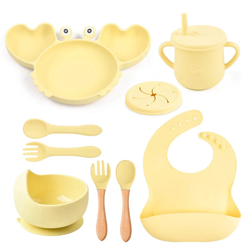 9-piece best silicone baby feeding set including a non-slip suction bowl, plate, spoon, waterproof bib, cup, and crab-shaped dishes. BPA-free and designed for children aged 7-36 months, this dinnerware set ensures safe and mess-free mealtime.