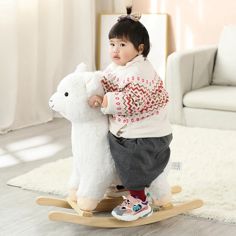 WhimsiRock™ Plush Animal Rocker: A super soft and huggable Plush Animal Rocker designed for toddlers aged 1-5, with solid wood handles and hypoallergenic filling. Perfect for imaginative play and safe, gentle rocking. a baby sitting on happy alpaca