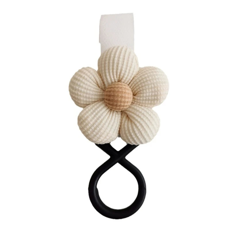 BloomLoop™ Baby Stroller Hook in White - Versatile stroller accessory with a small flower pattern for extra storage.