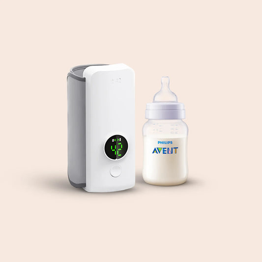 WarmMilk Pro™: The Smart Rechargeable Nursing Bottle Warmer in use, showcasing its digital display and sleek design.