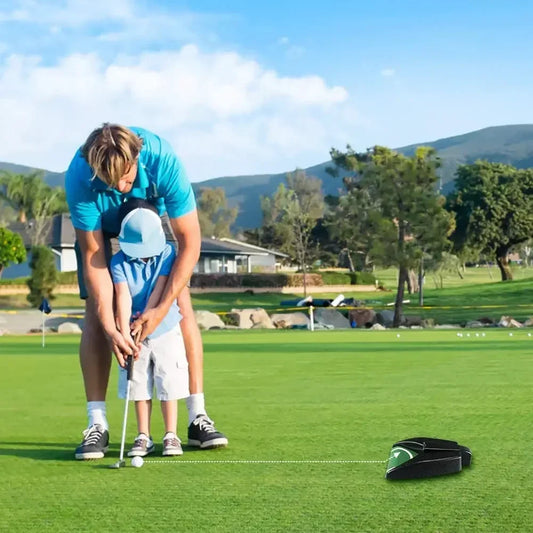 A kid playing and Practicing Putting with his father with Putt Buddy™ Automatic Golf Ball Returner - Compact and Portable Design